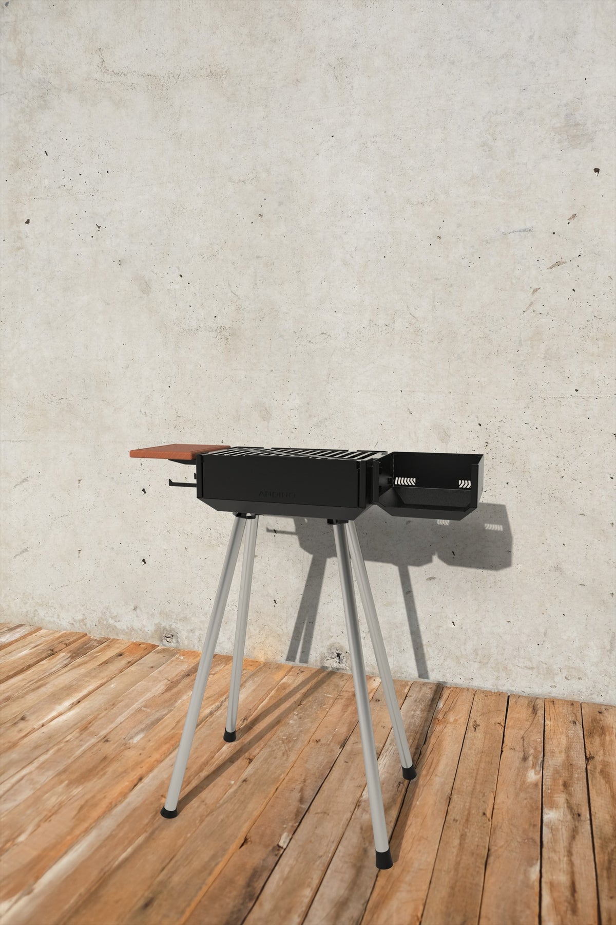 Yanus portable grill set up outdoors with side brazier box