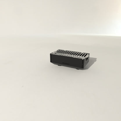 Yanus portable grill folded for transport