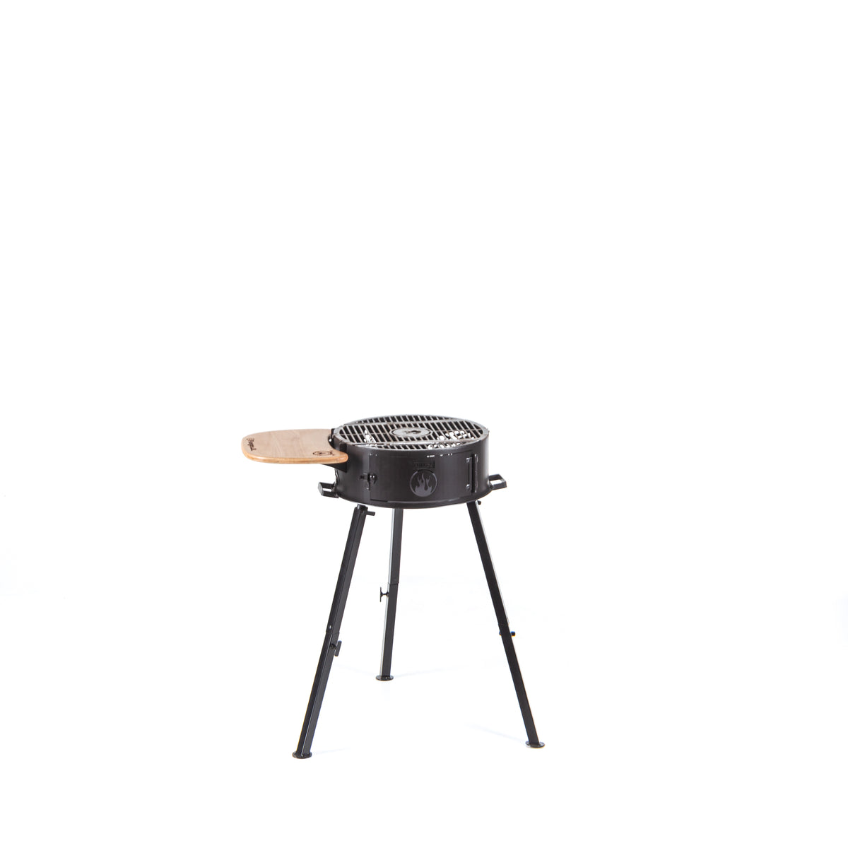 Cowboy portable grill with the grate flat, on its detachable three-leg frame