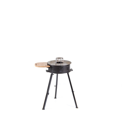 Cowboy portable grill closed, showing the ember basket and wood surface
