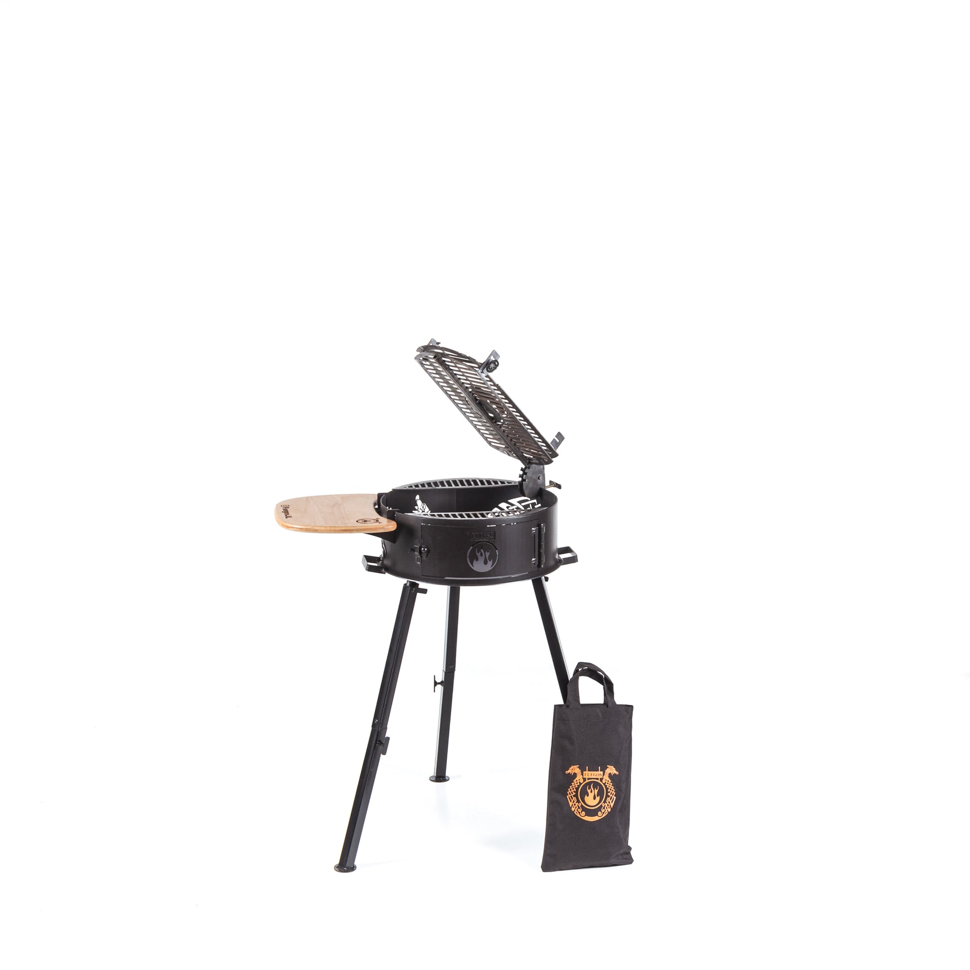 Cowboy portable grill next to the included travel cover bag