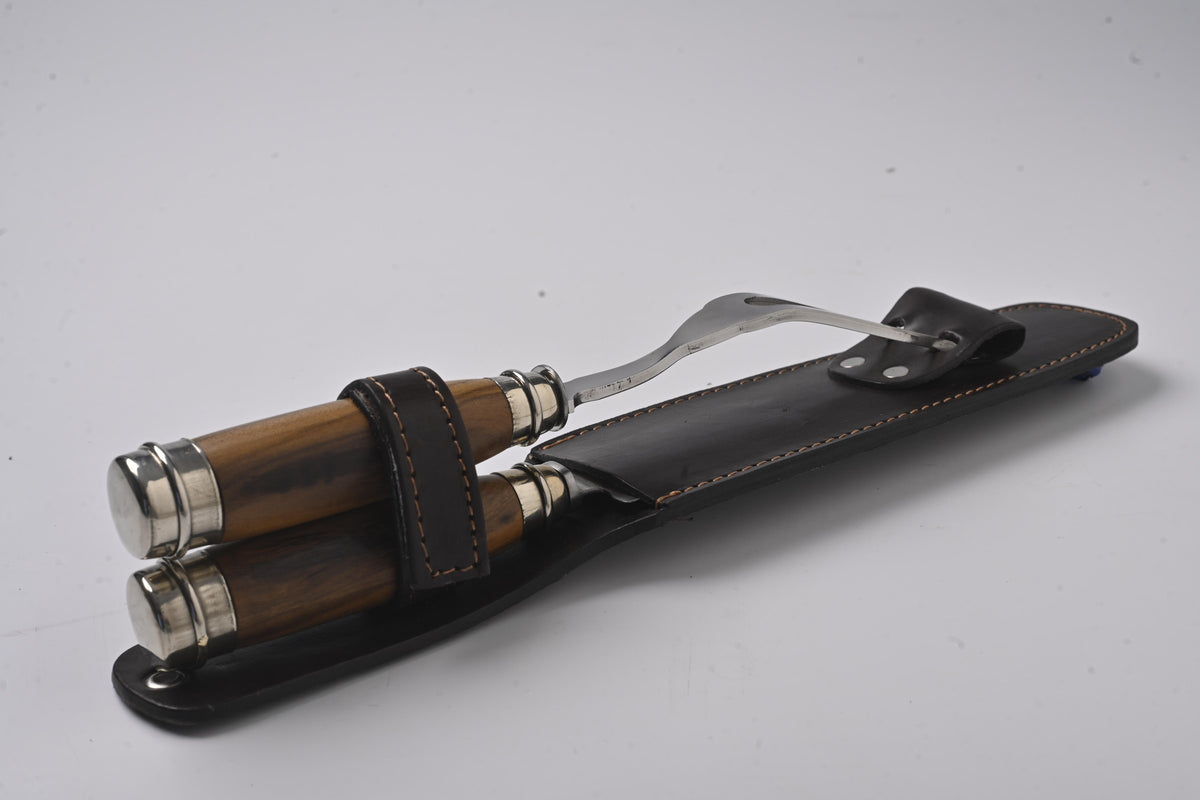 Wood and nickel-silver knife and fork stored in their leather sheath