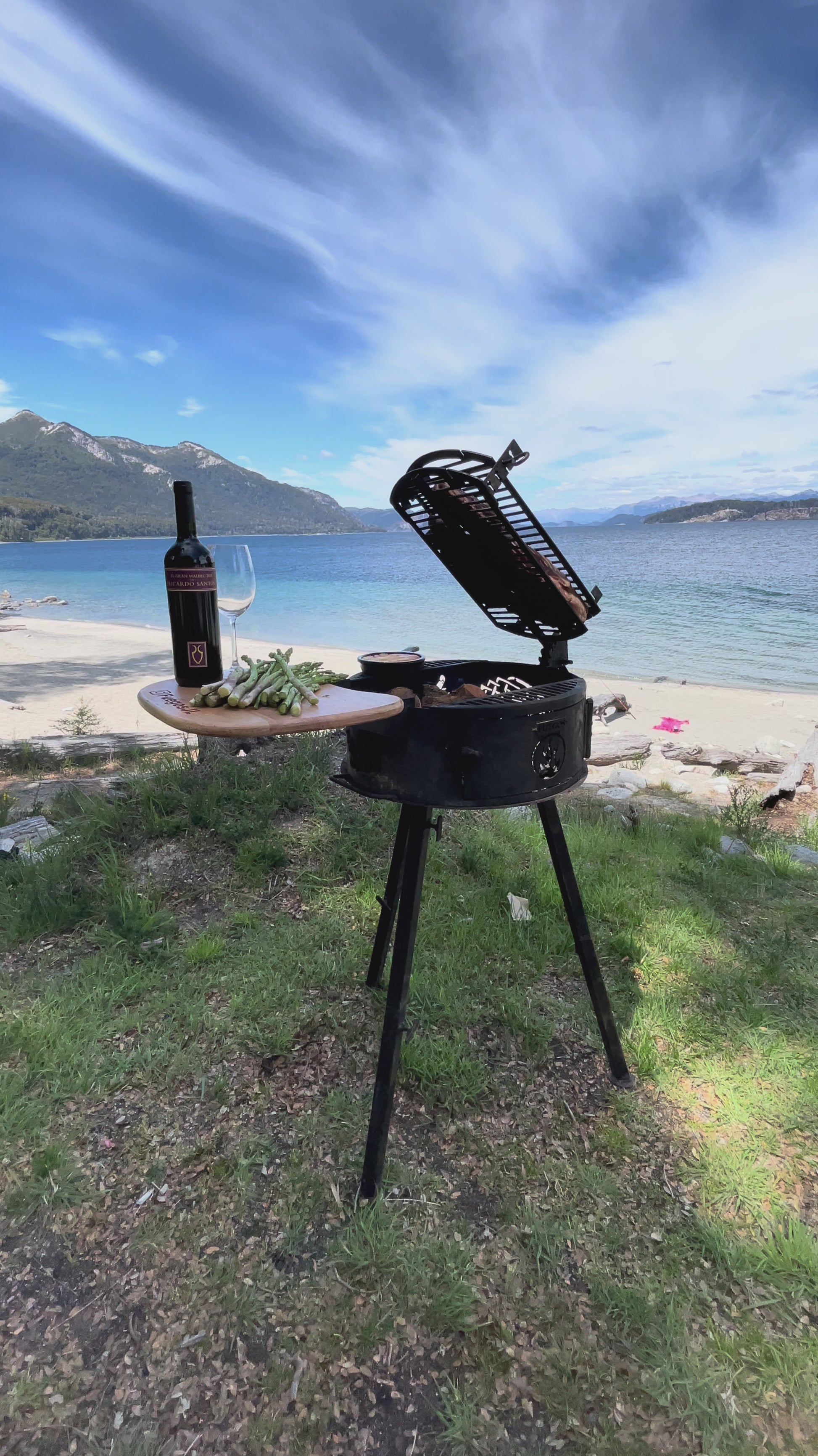 Cowboy portable grill cooking over live fire